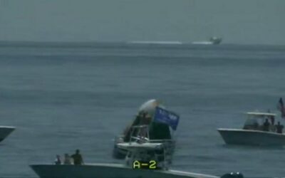 SpaceX splashdown: Dozens of boats including one with Trump flag circle around Nasa astronauts as they return to Earth