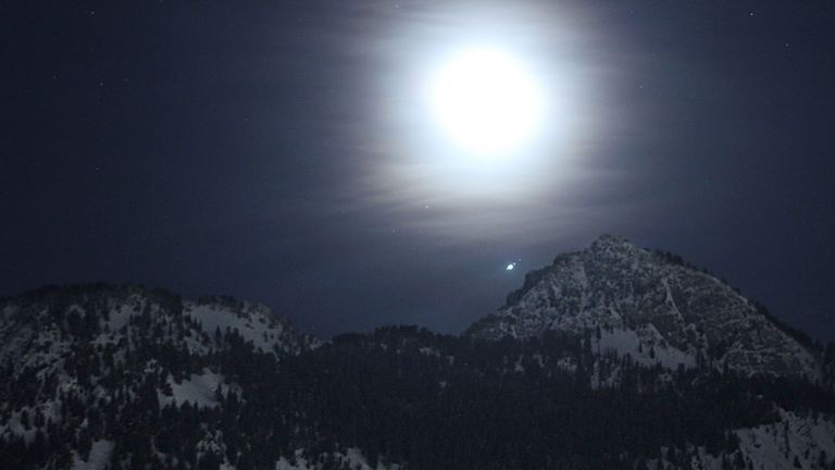 Pic: Jupiter and several of its large moons appear above the mountains of Utah. Pic: NASA/Bill Dunford