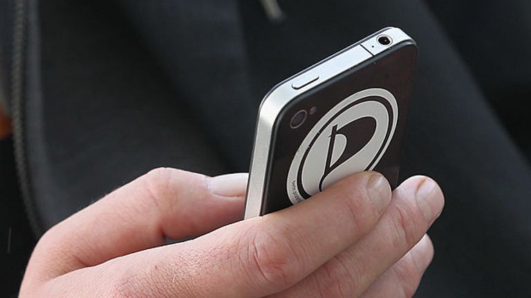 BERLIN, GERMANY - OCTOBER 05: A member of the Piratenpartei (Pirate Party) taps on an iPhone before a press conference October 5, 2011 in Berlin, Germany. The Piratenpartei is seeking to capitalize on its recent success in Berlin city elections as recent nationwide polls indicate that 8% of the German population would supoort the party in federal elections. (Photo by Sean Gallup/Getty Images) 