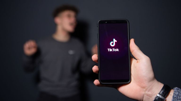 An AFP collaborator poses for a picture using the smart phone application TikTok on December 14, 2018 in Paris. - TikTok, is a Chinese short-form video-sharing app, which has proved wildly popular this year. (Photo by - / AFP) (Photo credit should read -/AFP via Getty Images) 