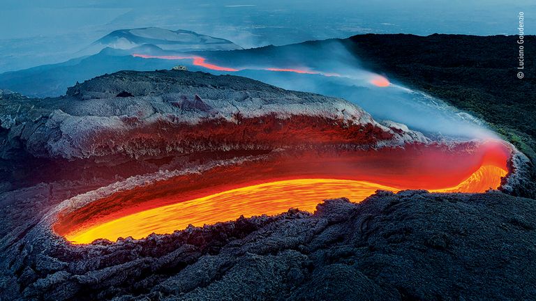 In the spring of 2017 an eruptive mouth opened on the southern side of Etna giving rise to one of the most important lava rivers of the last years of activity of the great volcano..After almost 2000 meters of trekking, I am exhausted but at the same time incredulous in front of such a spectacle and the emotion makes me forget the efforts. © Luciano Gaudenzio/ Wildlife Photographer Of The Year 2020